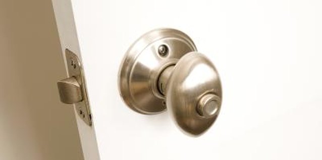 Jupiterimages/Photos.com/Getty Images Push-button locks are usually found on interior doors.