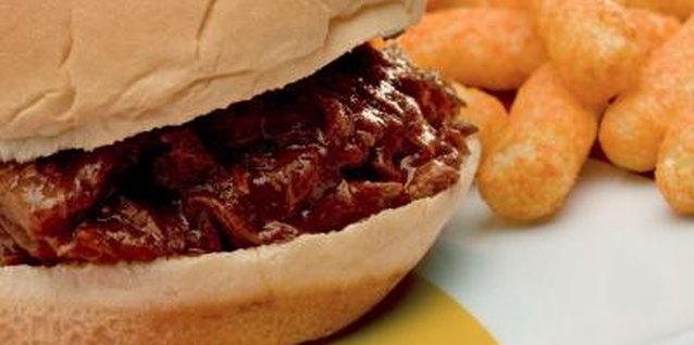 Jupiterimages/liquidlibrary/Getty Images Slow cookers make pulled pork easy.