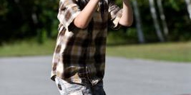 Jupiterimages/Photos.com/Getty Images Teach your child the basics of basketball.
