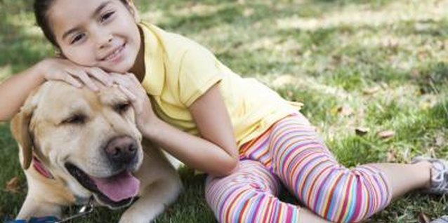 Jupiterimages/Creatas/Getty Images Keep your lawn tidy to help control fleas and ticks outdoors.