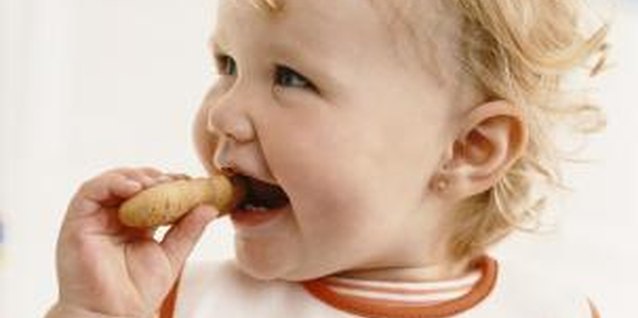 Digital Vision./Digital Vision/Getty Images Provide your 1-year-old with an alternative to biting his older sister.