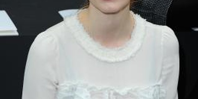 Pascal Le Segretain/Getty Images Entertainment/Getty Images Actress Jessica Chastain keeps accessories to a minimum while sporting a white ruffled blouse.