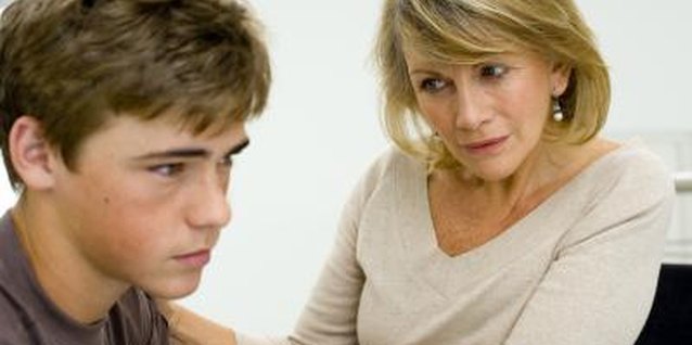 Jupiterimages/Pixland/Getty Images Your son could have trouple adjusting to his new stepmom, so support him without taking sides.