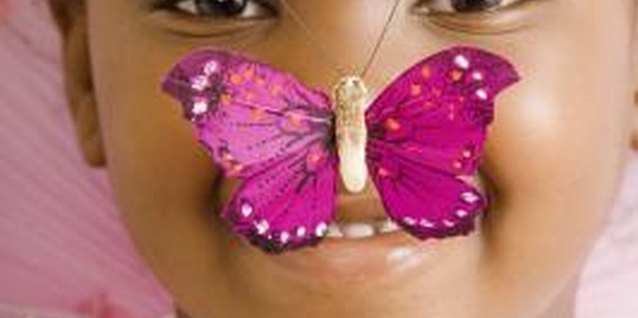 Creatas Images/Creatas/Getty Images Girls appreciate the beauty of butterflies.