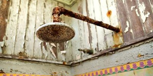 Jupiterimages/Photos.com/Getty Images Left unchecked, condensation can damage paint, pipes and electrical fixtures.