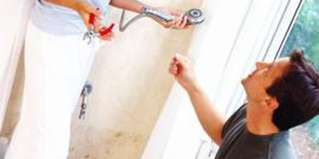 Stockbyte/Stockbyte/Getty Images Fix crumbly shower wallboard before it goes too far.
