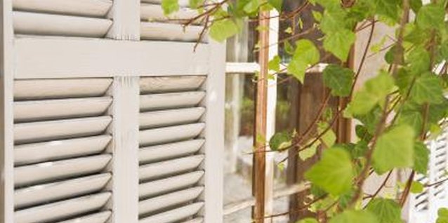 Jupiterimages/Polka Dot/Getty Images Repurpose shutters for functional and decorative use in and around the home.