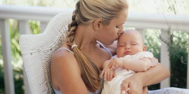 Digital Vision./Digital Vision/Getty Images Spending time with the baby can make your husband feel left out.