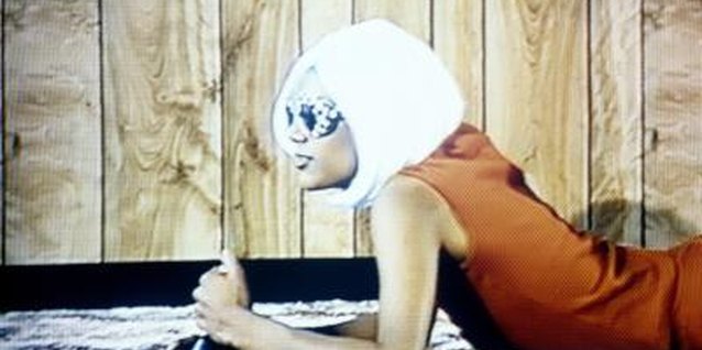 Agri Press/Lifesize/Getty Images Shorten your synthetic wig to create an entirely new style.