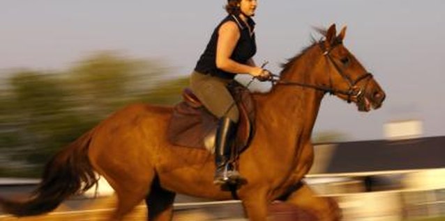 George Doyle/Stockbyte/Getty Images Replace your office chair with a stability ball to improve your performance in the saddle.