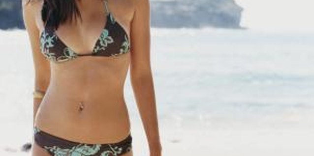 Digital Vision./Digital Vision/Getty Images Ladies with broad shoulders have several options when choosing bikini tops.