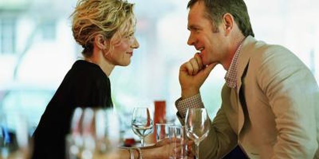 Digital Vision/Photodisc/Getty Images Keep romantic moments private when first dating a single father.