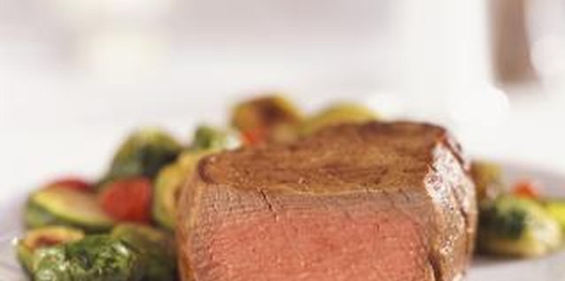Digital Vision./Digital Vision/Getty Images Steak can be part of a healthy meal when paired with vegetables.