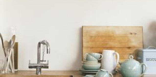 Digital Vision./Photodisc/Getty Images Put colorful dish towels to work as decor around your kitchen.