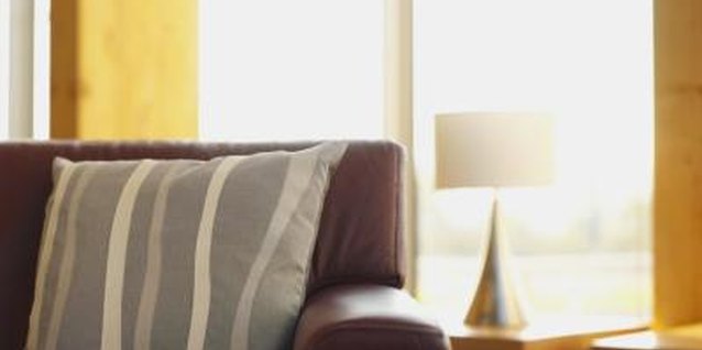 George Doyle/Stockbyte/Getty Images Keep the cushion in place with a few decorator's tricks.