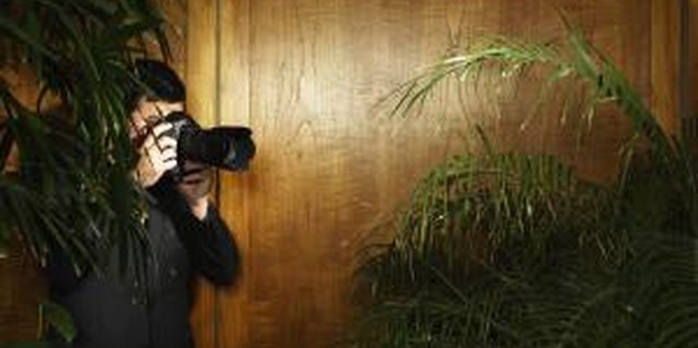 Ryan McVay/Digital Vision/Getty Images If he refuses to be honest about his activities, check your state's surveillance laws before you buy a cam or engage in other forms of surveillance..
