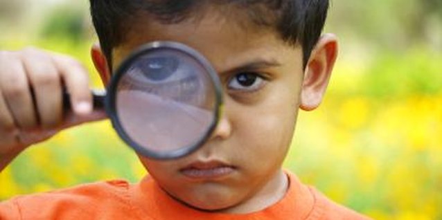 Visage/Stockbyte/Getty Images Your little gumshoe can discover a lot with a magnifying glass.