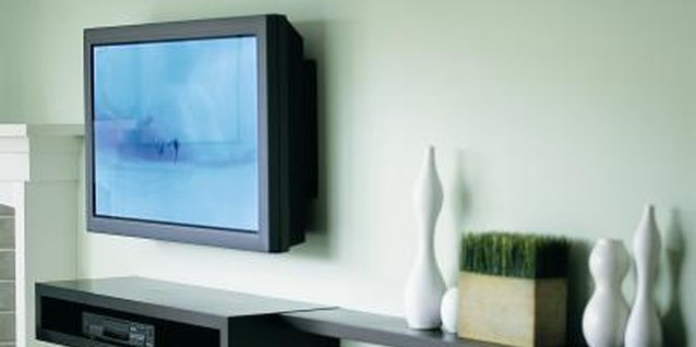 Digital Vision./Photodisc/Getty Images A long wall ledge in the same finish extends the surface of a storage cabinet.
