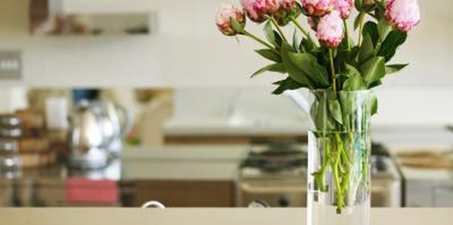 George Doyle/Stockbyte/Getty Images Freshen your kitchen by fixing worn laminate.