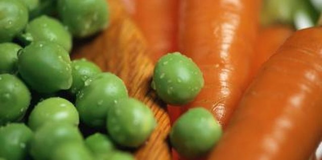 Stockbyte/Stockbyte/Getty Images Peas and carrots both supply fiber.