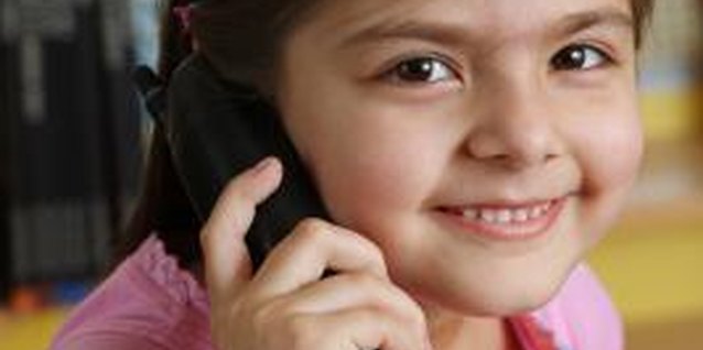 Visage/Stockbyte/Getty Images Older children can answer the phone as long as they know the rules.