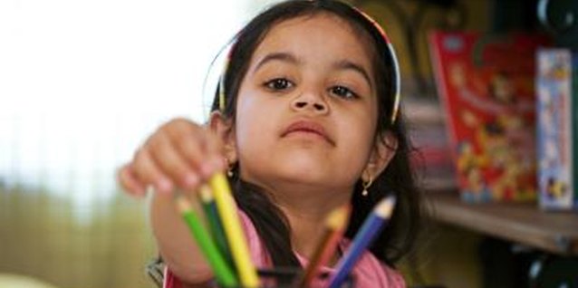 Visage/Stockbyte/Getty Images Blank walls often tempt children to draw on them.