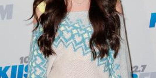 Imeh Akpanudosen/Getty Images Entertainment/Getty Images Actress Ryan Newman keeps it simple with basic hoops and a small pendant to complement her sweater.