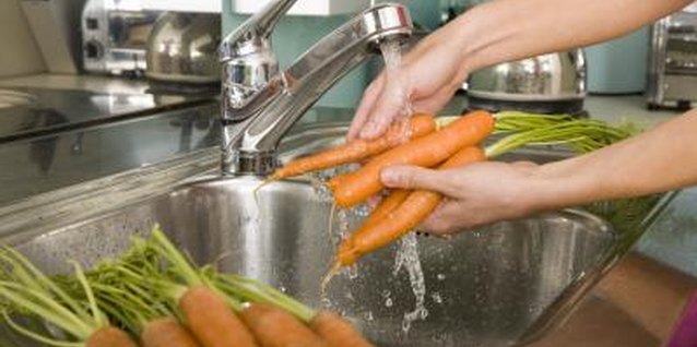 Adam Gault/Digital Vision/Getty Images Use the smallest amount of water to minimize nutrient loss.
