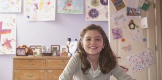 Jack Hollingsworth/Photodisc/Getty Images Hang your child's artwork to depict Rapunzel's artistic walls.