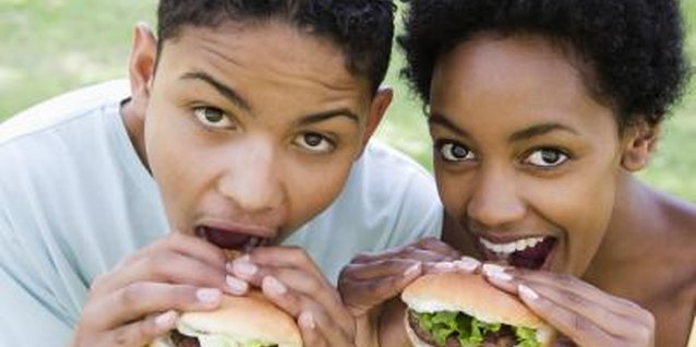 BananaStock/BananaStock/Getty Images Use gentle encouragement to get your teen to eat meat again.