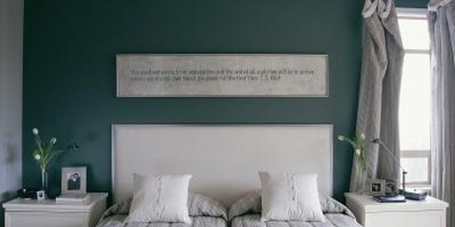 Digital Vision./Digital Vision/Getty Images Push two beds very close together to free up floor space for other activities.