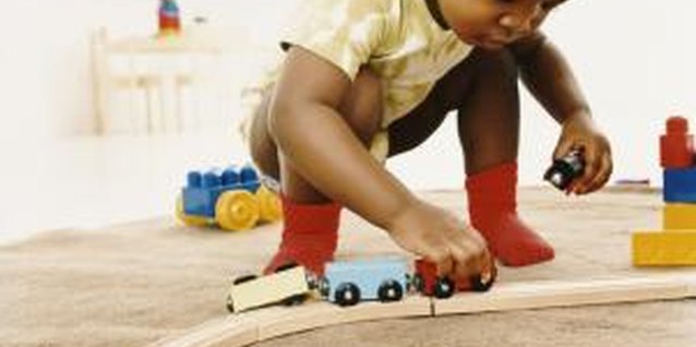 Digital Vision./Digital Vision/Getty Images Toy trains encourage your child to use her imagination.