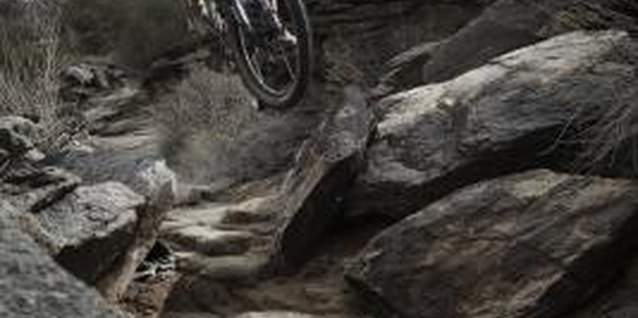 Thomas Northcut/Digital Vision/Getty Images Steep descents through rugged terrain require a sturdy bike.