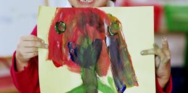 Katy McDonnell/Digital Vision/Getty Images Painting a self-portrait can help your preschooler understand her feelings.