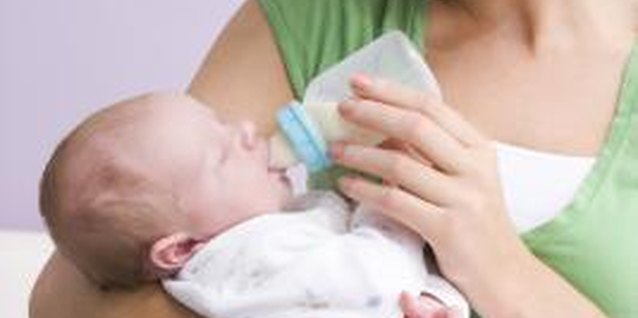BananaStock/BananaStock/Getty Images Your baby will let you know when she needs her bottle.