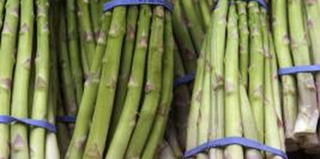 Michael Blann/Digital Vision/Getty Images Keep the garden weed free to better your chances of a large asparagus harvest.