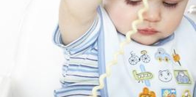 James Woodson/Digital Vision/Getty Images Babies learn how the world works through play.