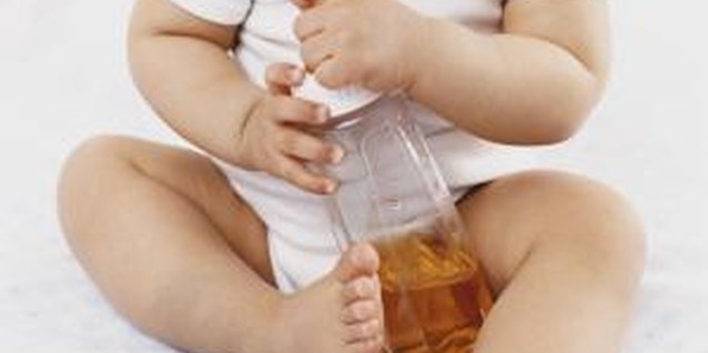Digital Vision./Digital Vision/Getty Images Wrenching bottles out of her tight little grasp takes time.