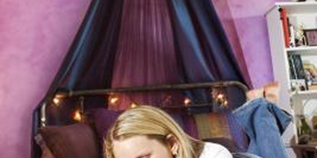 Thinkstock/Comstock/Getty Images Curtains set the style for more than windows in a teen bedroom.