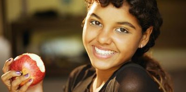 Jupiterimages/Comstock/Getty Images Make nutritious snacks available for your teen to encourage healthy eating habits.