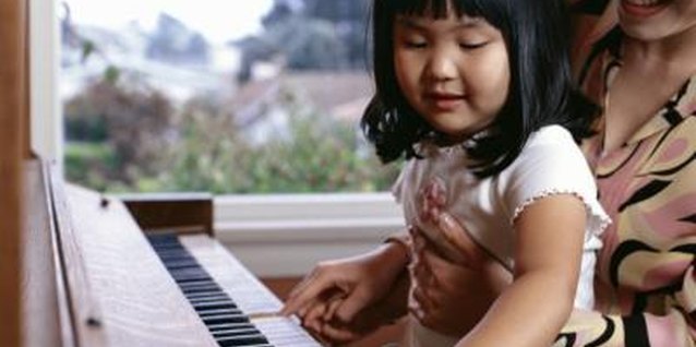 Creatas/Creatas/Getty Images Introduce your toddler or preschooler to music through fun piano books.