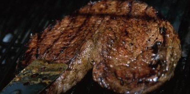 Hemera Technologies/Photos.com/Getty Images Marinate shoulder steaks before grilling or broiling.