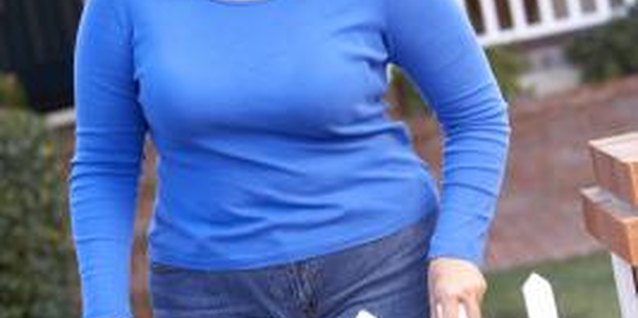 BananaStock/BananaStock/Getty Images Overweight teens should dress in ways that flatter their bodies.