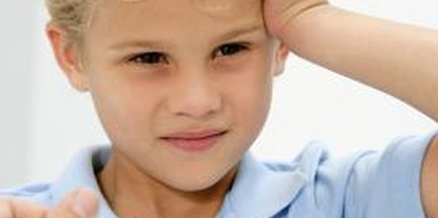 Goodshoot/Goodshoot/Getty Images Check your child's temperature to rule out fever.