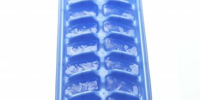 Jupiterimages/Comstock/Getty Images Grab an ice cube tray and some fruit for kid-friendly frozen treats.