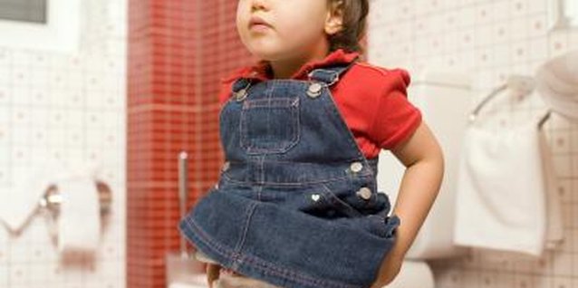 Thinkstock Images/Comstock/Getty Images Ideally, your toddler shows interest in learning to use the potty.