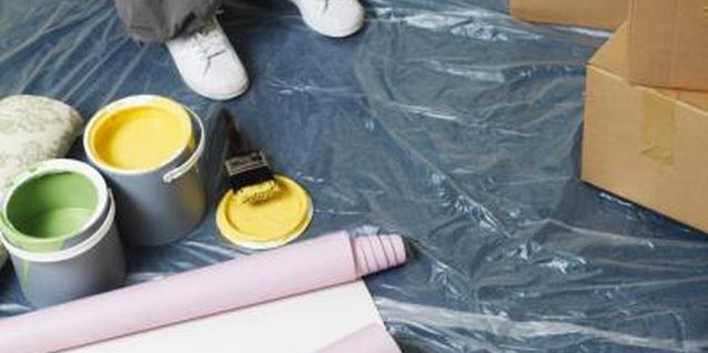 Stockbyte/Stockbyte/Getty Images Cover the work area well before you start painting your shades.
