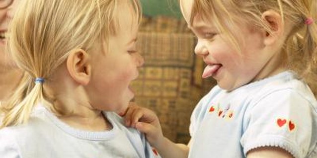 Hemera Technologies/AbleStock.com/Getty Images Twin toddlers often compete with each other.
