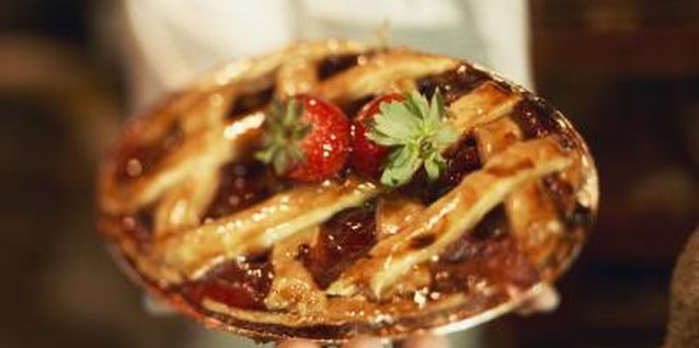 Jupiterimages, Brand X Pictures/Brand X Pictures/Getty Images Garnish a fresh or baked strawberry pie with a few whole strawberries.