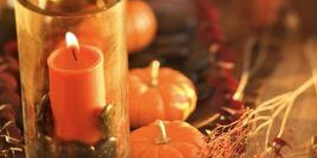 Thinkstock/Comstock/Getty Images Dress up your tables for fall with a candle display.